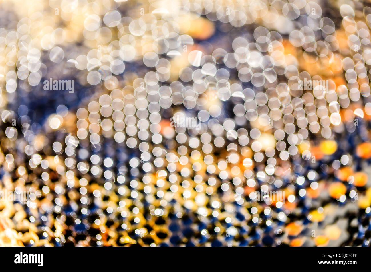 Bokeh sfondo da alveare ape. Sfondo spot luminoso astratto. Foto Stock
