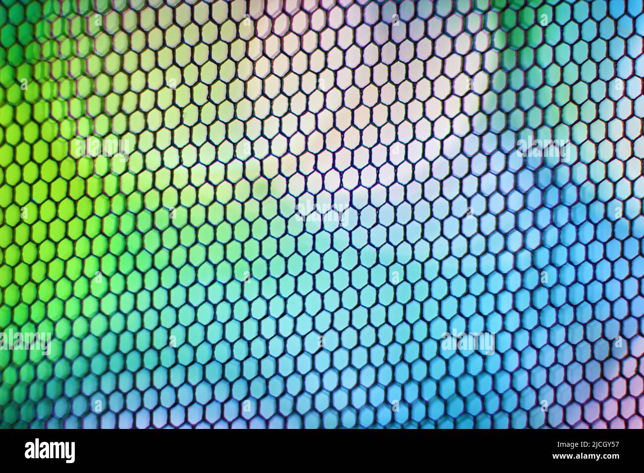 Sfondo astratto multicolore con griglia a nido d'ape. Sfondo dal design luminoso. Foto Stock
