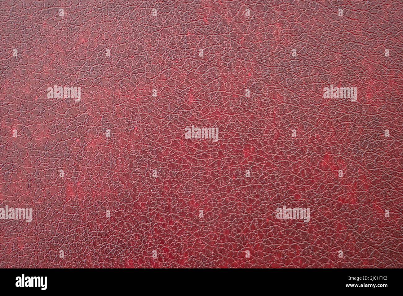 Primo piano di similpelle rosso scuro, similpelle come texture o sfondo Foto Stock