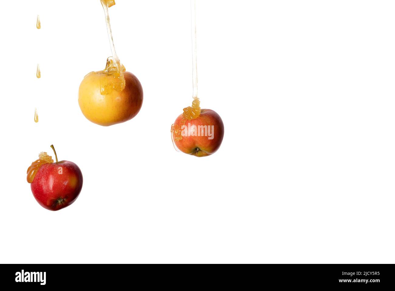 Il miele cade su tre mele. Alta qualità Foto Stock