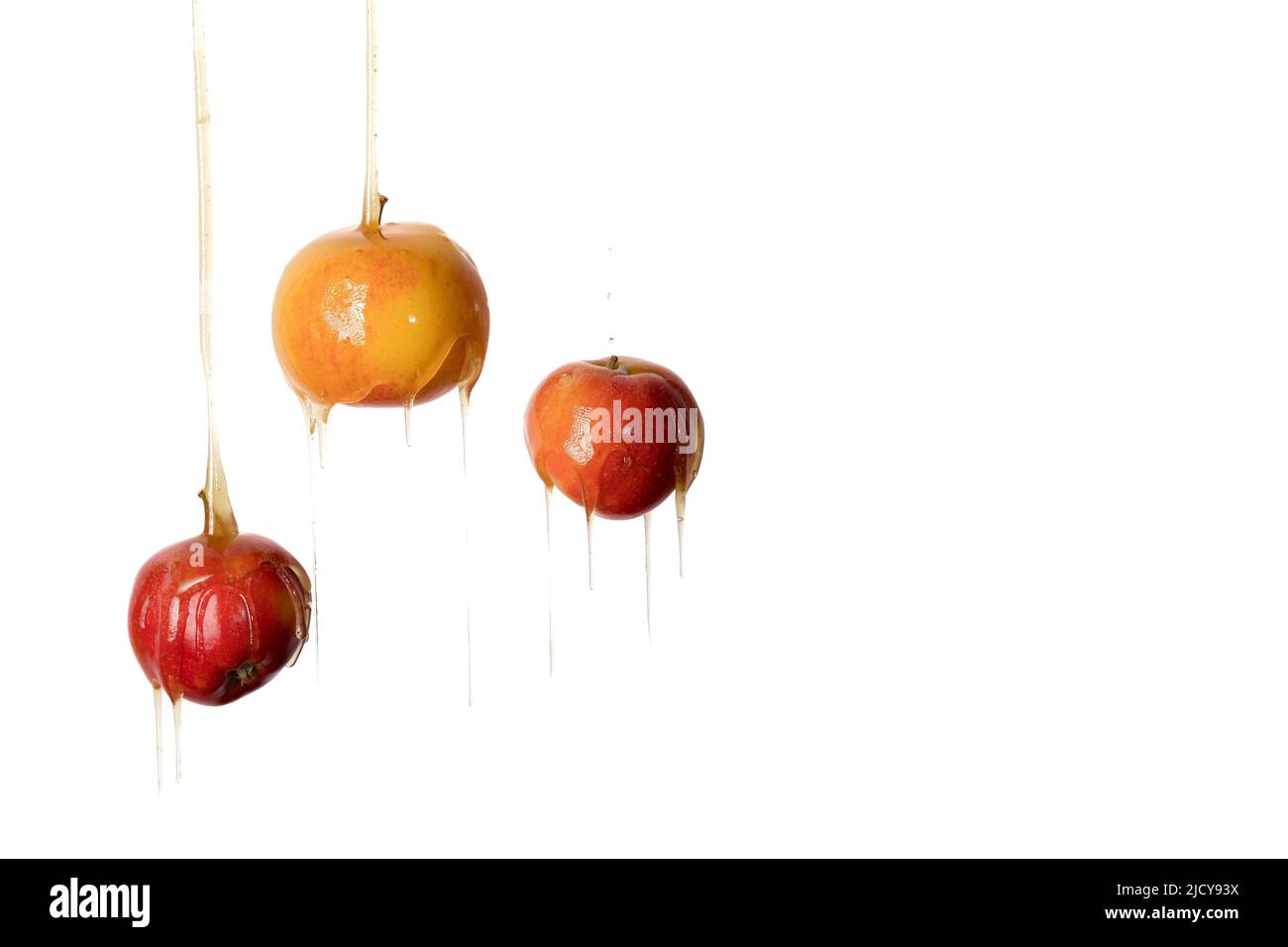 Il miele scorre su tre mele. Alta qualità Foto Stock