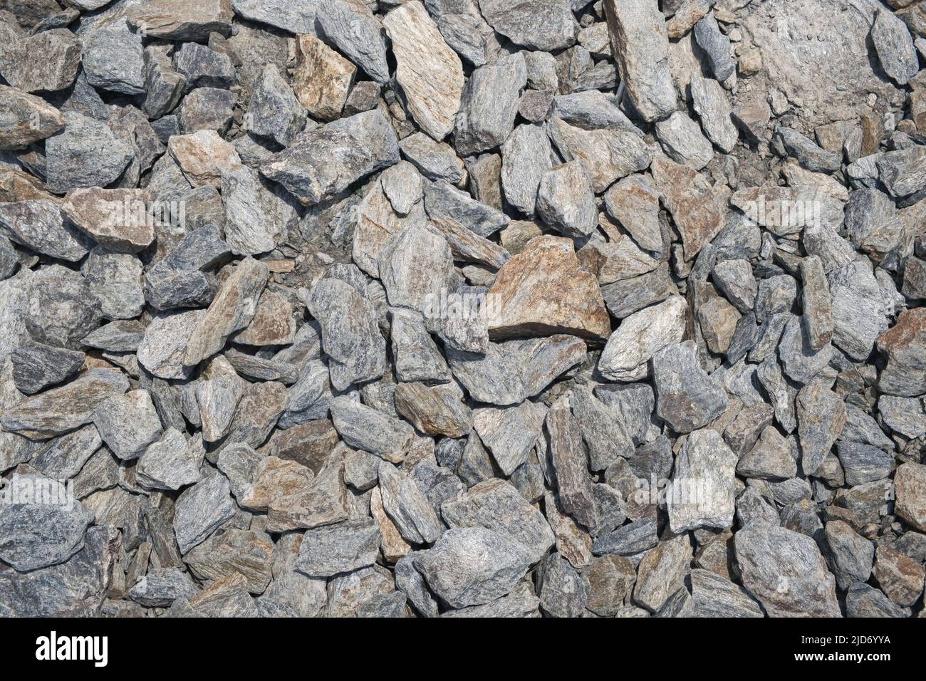 Un sacco di pietre di granito grigio come sfondo naturale astratto. Foto Stock