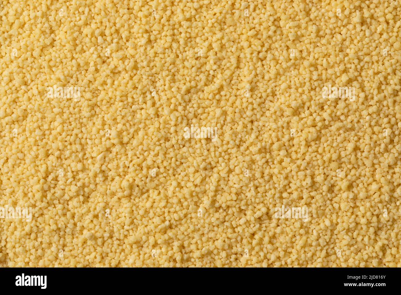 Il couscous secco non cotti si avvicina al telaio completo come sfondo Foto Stock