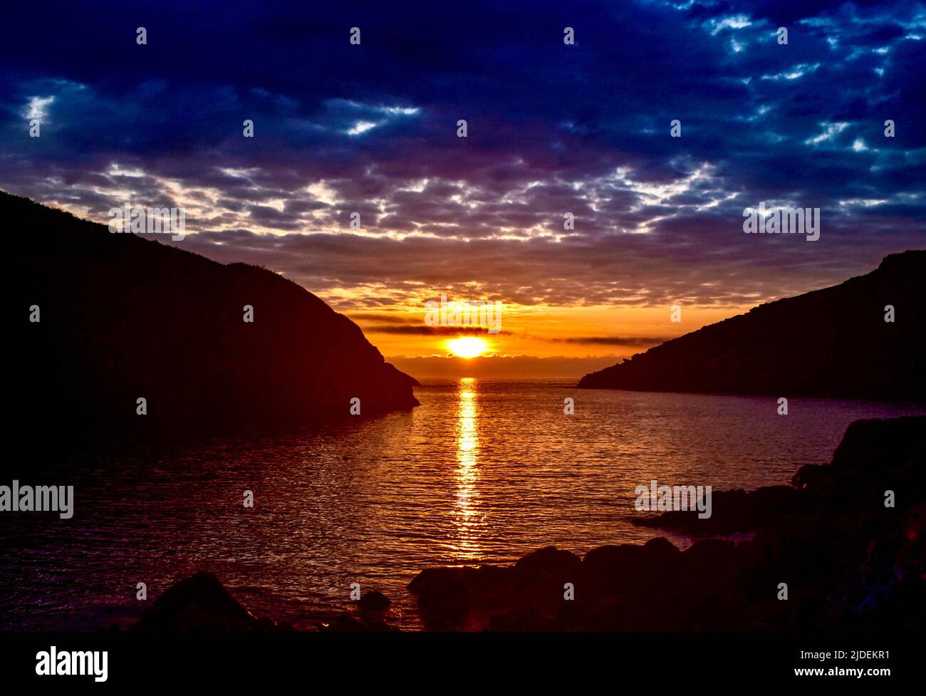 Tramonto sulla spiaggia di Port Quin. Foto Stock