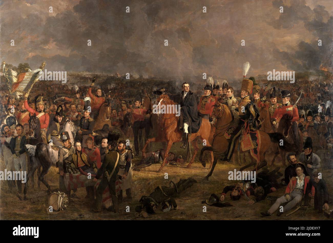 La battaglia di Waterloo, Jan Willem Pieneman, 1824 -qui il duca di Wellington riceve il messaggio che le forze prussiane stanno venendo al suo aiuto. Wellington, comandante delle truppe anglo-olandesi, è la figura centrale in questo ritratto di gruppo dei principali giocatori di Waterloo. Ferito su una barella in primo piano a sinistra è il principe ereditario olandese, poi re Guglielmo II Foto Stock