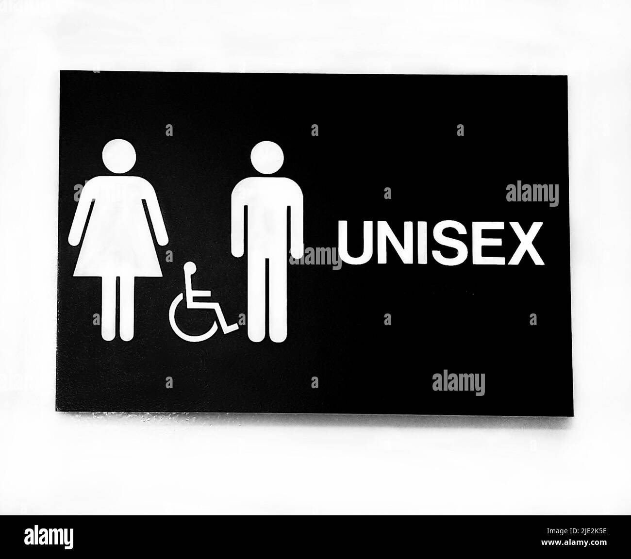 UNISEX e porta bagno handicap segno in un negozio pubblico nel nord centro della Florida. Foto Stock