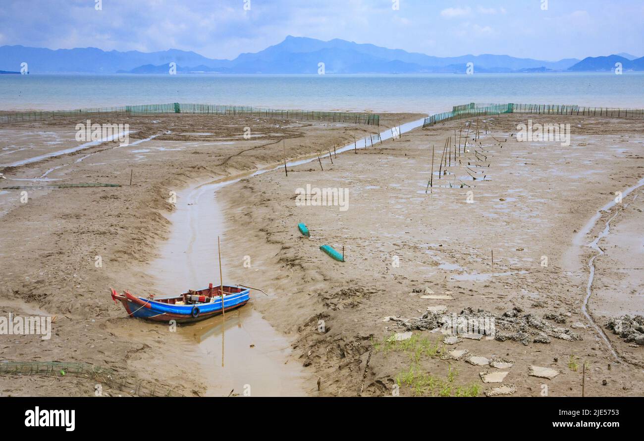 Zhejiang ningbo la marea di mare pianeggiante una nave Foto Stock