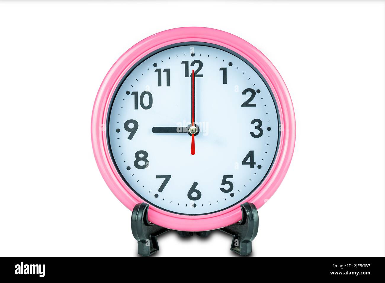 Bello orologio rosa mostra ora delle nove isolato su sfondo bianco con tracciato di clipping. Foto Stock