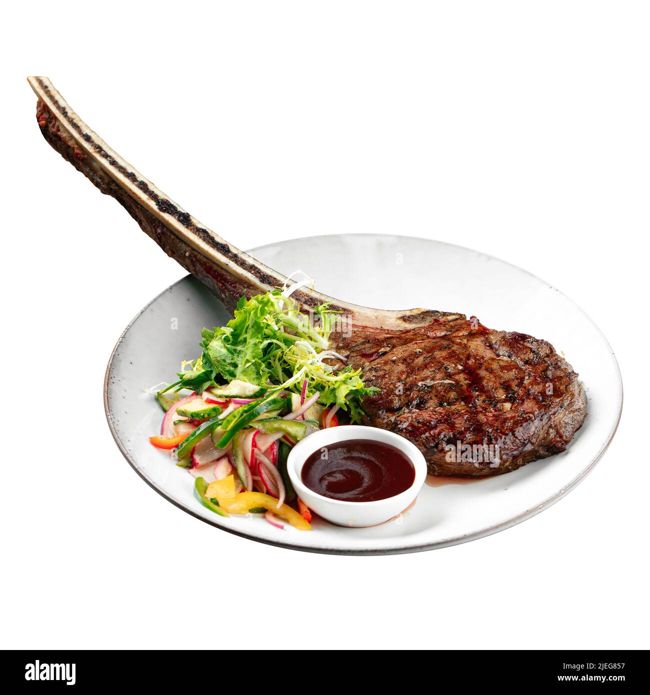 Porzione isolata di bistecca di manzo alla griglia di tomahawk Foto Stock