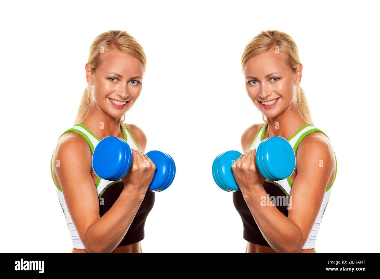 Zwei junge bionda Frauen trainieren mit einer Hantel im Fitnessstudio, Fitness-Studio, Zwiller, Foto Stock