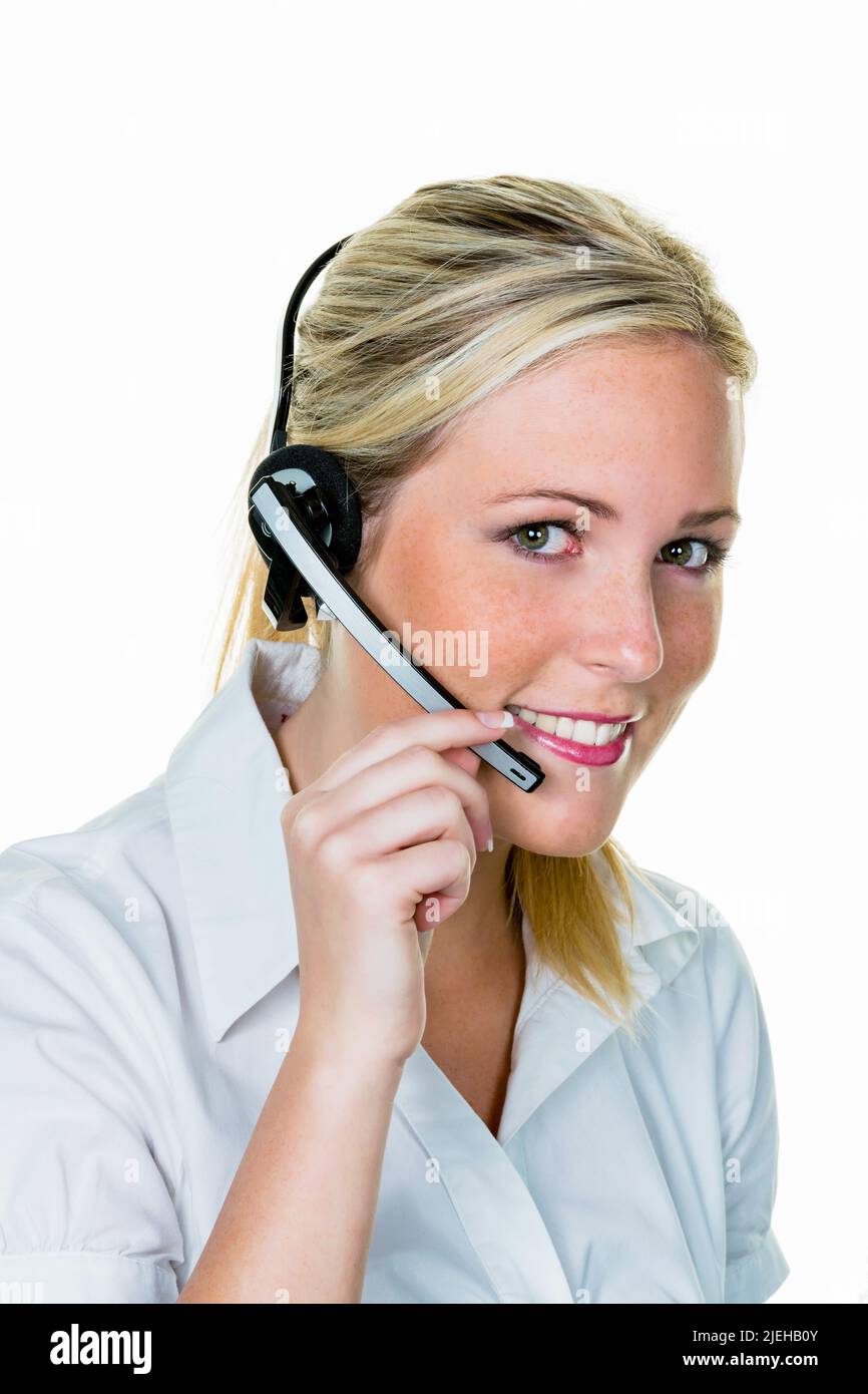 Eine junge Frau mit Headset.Symbolfoto f¸r Hotline, Kundenkontakt und Telefonzentrale. Foto Stock