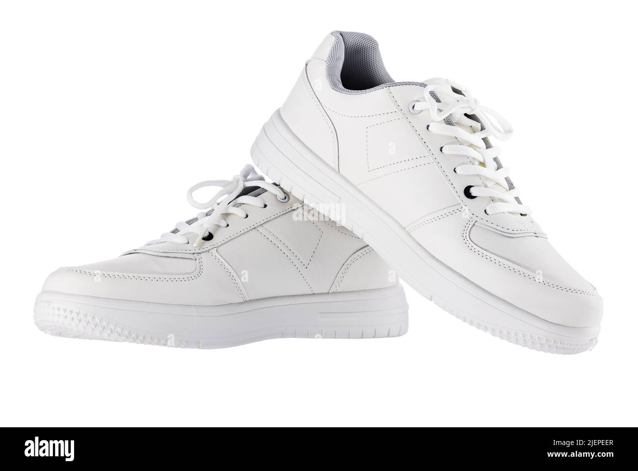 Sneaker eleganti isolate su sfondo bianco. Set di scarpe sportive bianche. Foto Stock