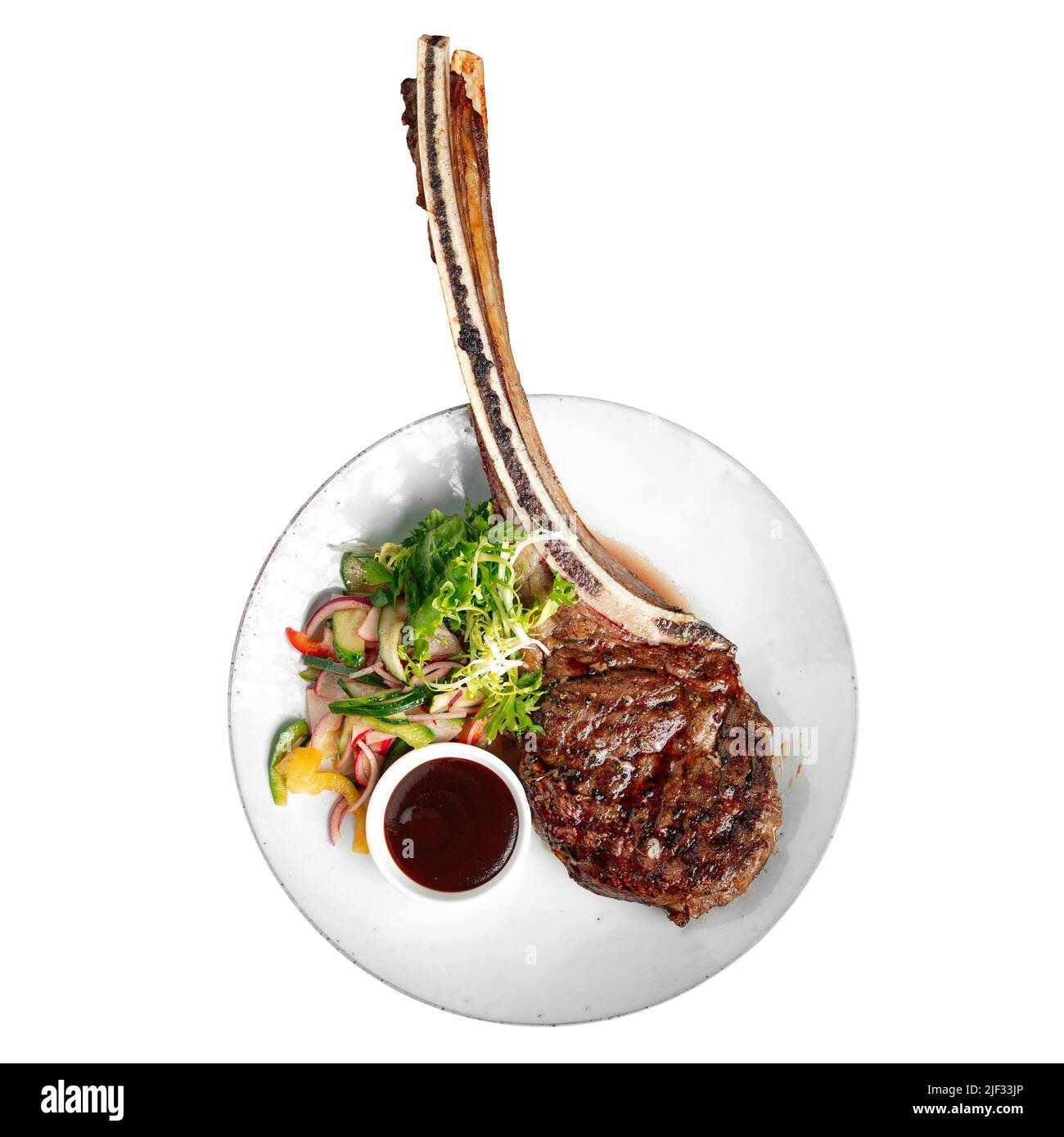 Porzione isolata di bistecca di manzo alla griglia di tomahawk Foto Stock