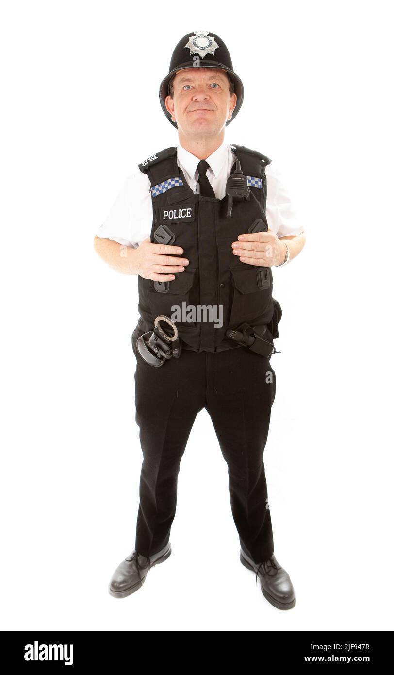 Un poliziotto britannico in uniforme allerta e preparato per dovere. Parte di una serie di immagini con lo stesso modello di carattere. Foto Stock