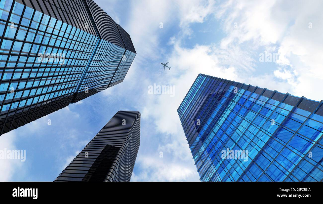 Un angolo basso di grattacieli moderni contro il cielo e un aereo Foto Stock