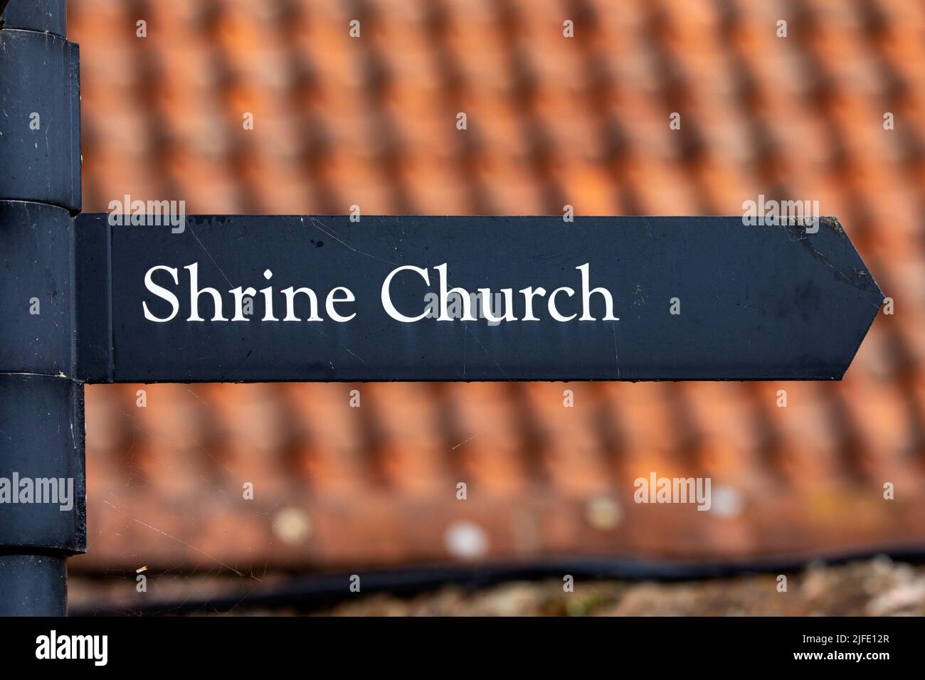 Cartello al Santuario di nostra Signora di Walsingham nel villaggio di Walsingham a Norfolk, Regno Unito. Foto Stock