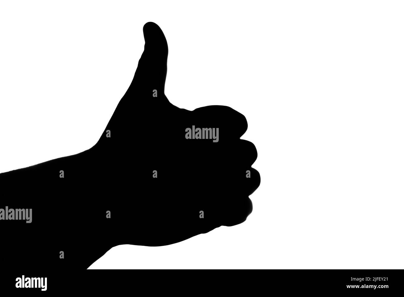 Silhouette a mano libera nera con un pollice sollevato su sfondo bianco. Mi piace. Foto Stock