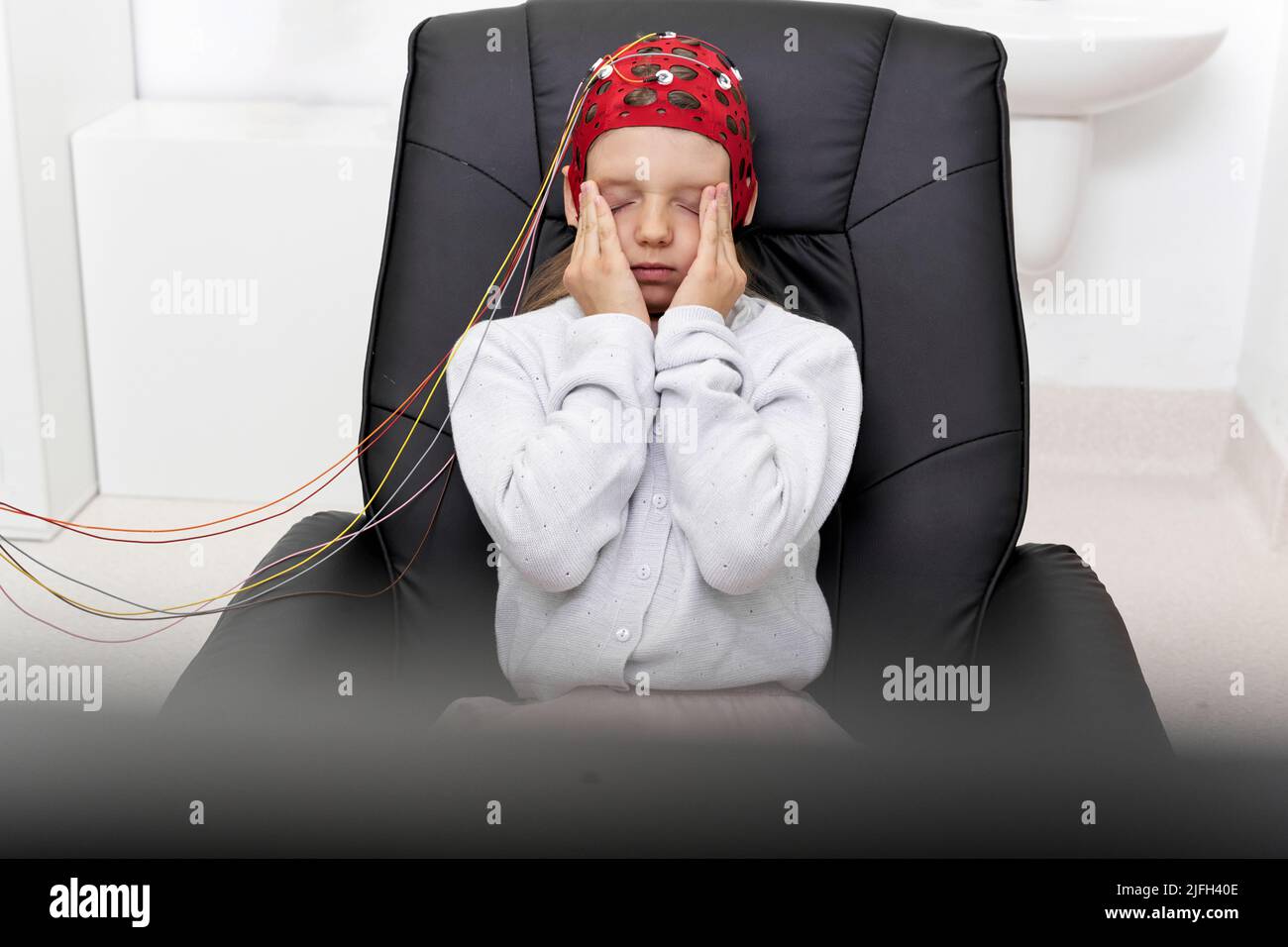 Paziente che gestiva la fatica durante una sessione di biofeedback Foto Stock