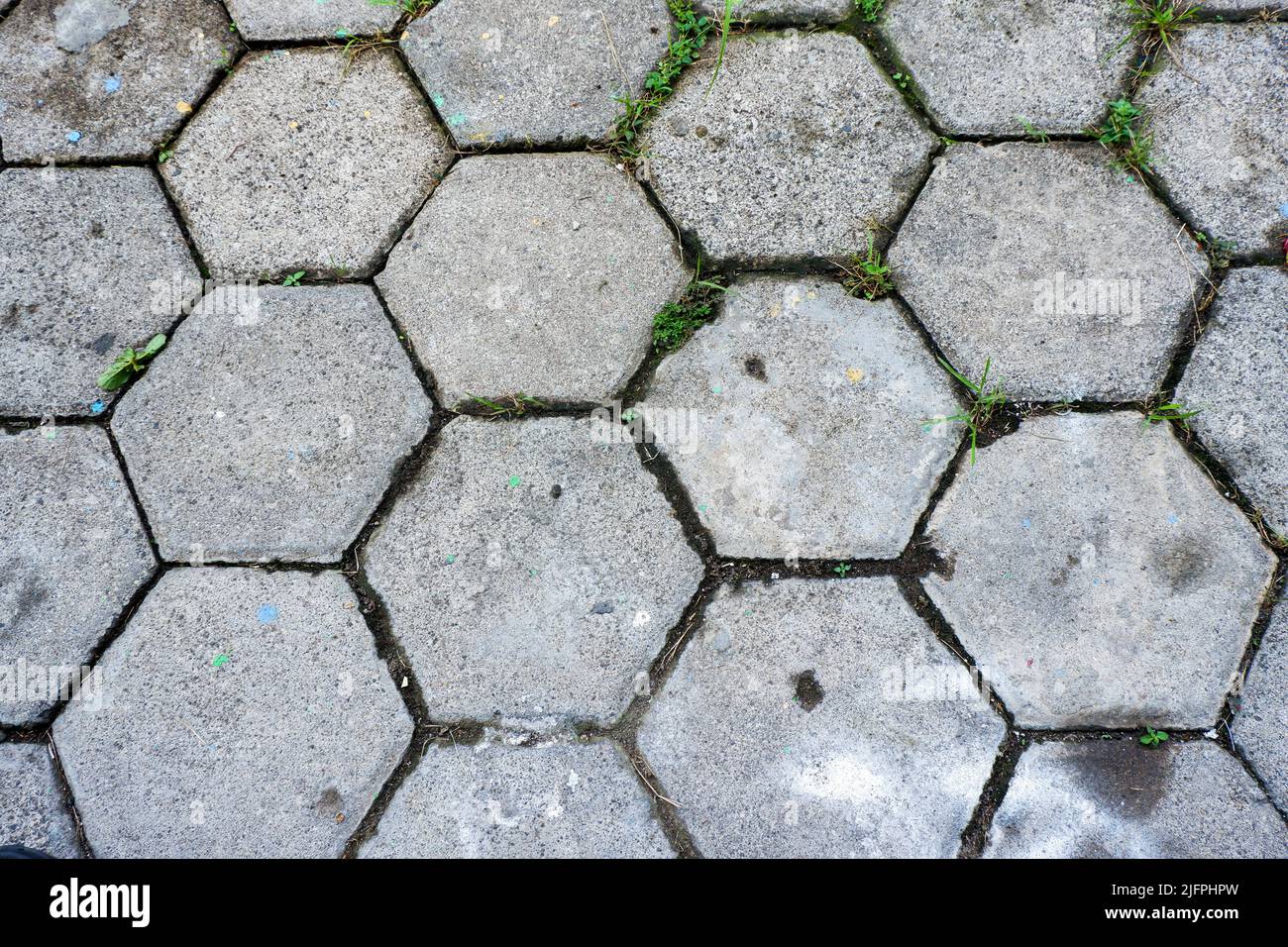 La texture della piastrella lastricata sul fondo della strada. Cemento mattone quadrato pietra pavimento sfondo. Pavimentazioni in calcestruzzo. Lastre di pavimentazione Foto Stock