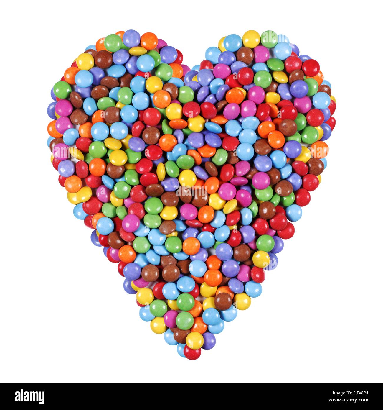 Forma del cuore fatta da caramelle multicolore Foto Stock