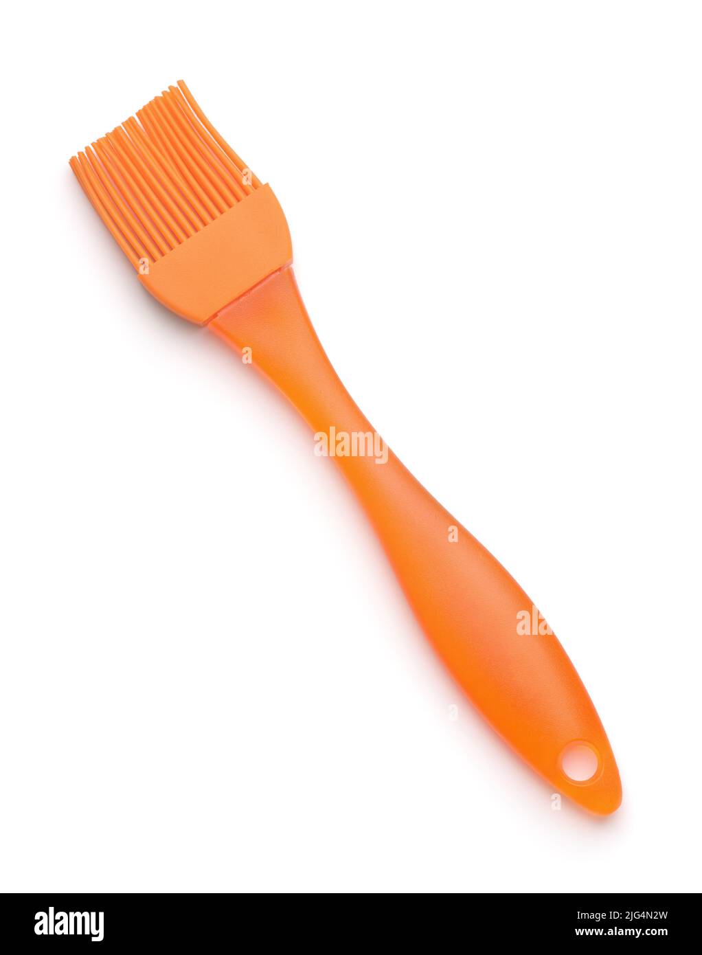 Spazzola di incollaggio all'olio di silicone arancione da cucina isolata su bianco Foto Stock