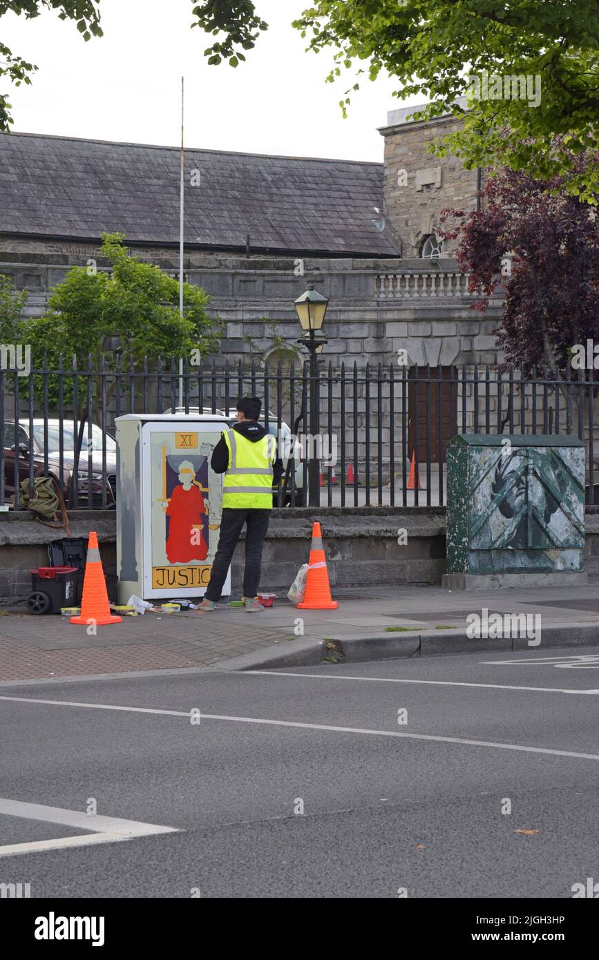 Artista di strada al lavoro a Stoneybatter, un'area vivace e alla moda di Dublino, Irlanda Foto Stock