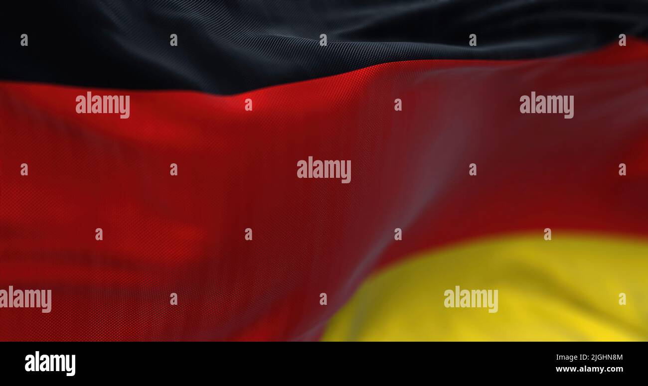 Vista ravvicinata della bandiera nazionale tedesca che sventola nel vento. La Germania è un paese europeo. Foto Stock