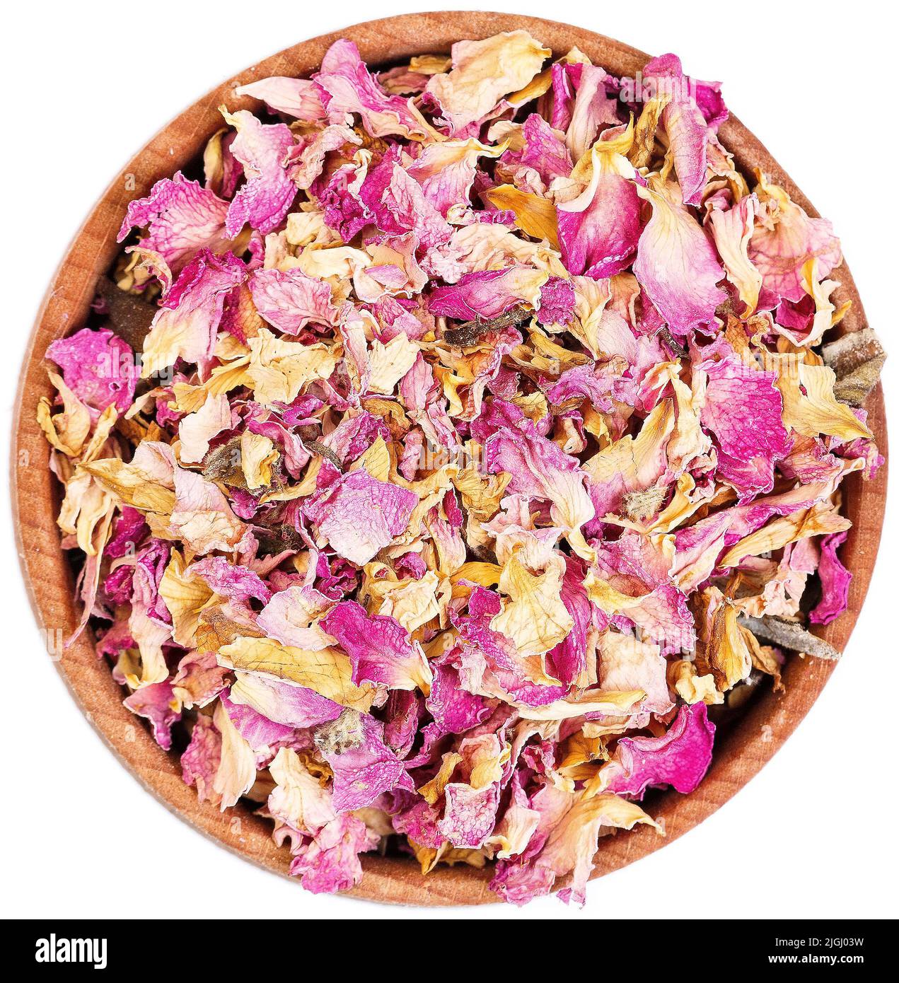 Petali di rosa essiccati in un piccolo arco di legno isolato. Foto Stock