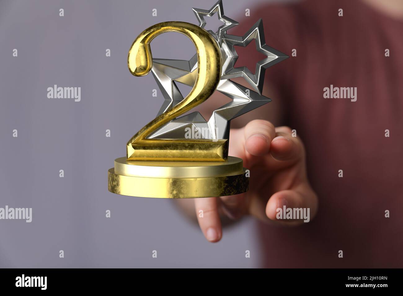 Un 3D rendering di un secondo posto Golden Award una mano maschile che tiene su uno sfondo sfocato Foto Stock