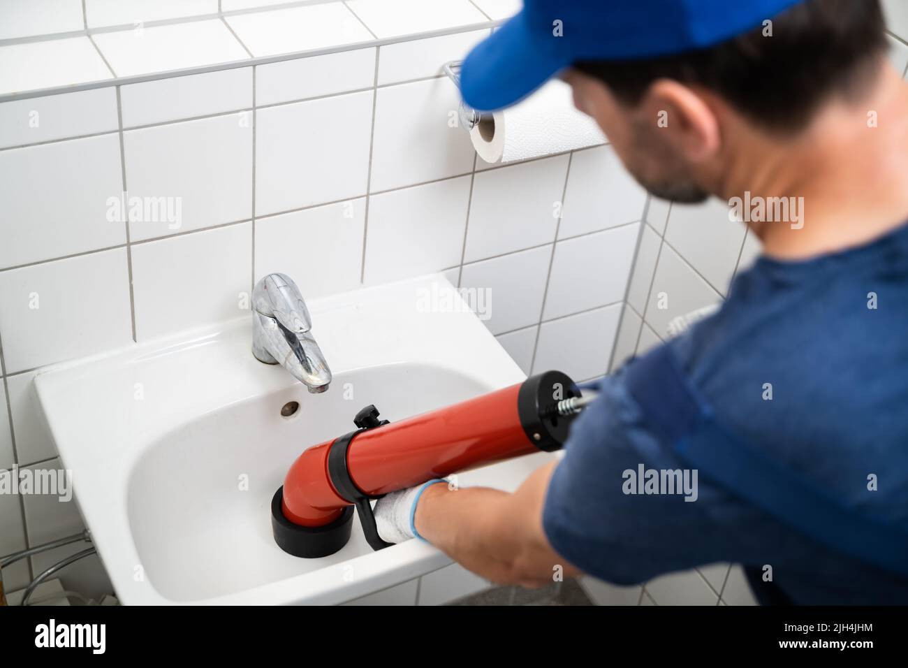 Scarico per la pulizia dell'idraulico e bagno con pompa Foto Stock