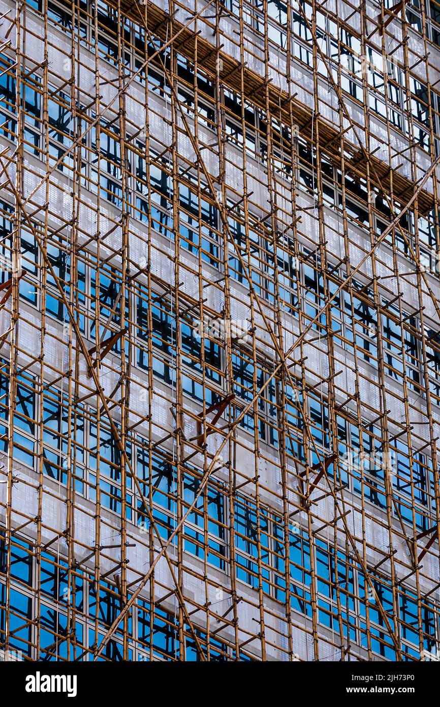 Ponteggi di bambù su un alto edificio commerciale, WAN Chai, Hong Kong Island, 2007 Foto Stock