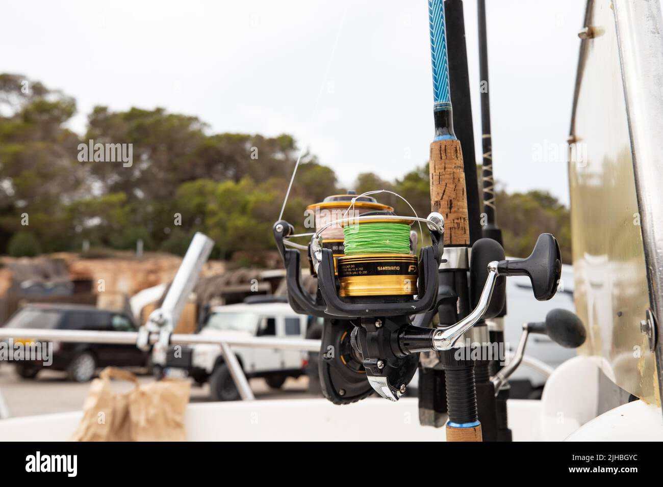 Mulinelli da pesca su canne a Pou des LLE, Ibiza. Foto Stock