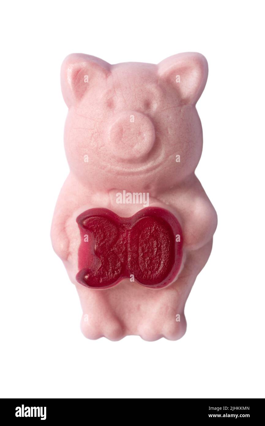 Dolce M&S Percy Pig che festeggia 30 anni fatto con vero succo di frutta isolato su sfondo bianco - edizione limitata Foto Stock