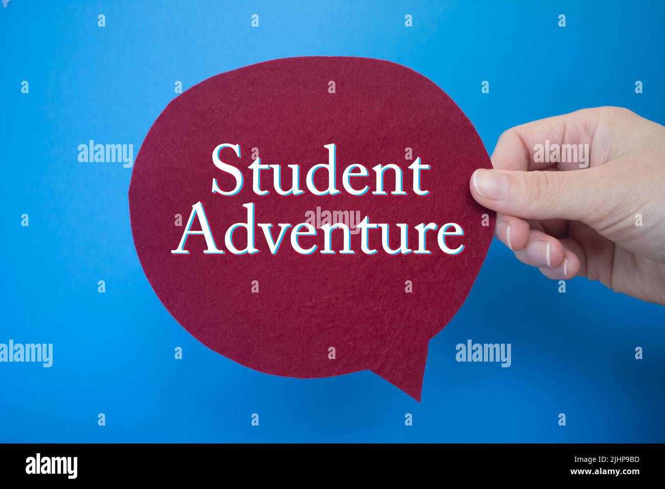 Fumetto di fronte a sfondo colorato con testo Student Adventure. Foto Stock