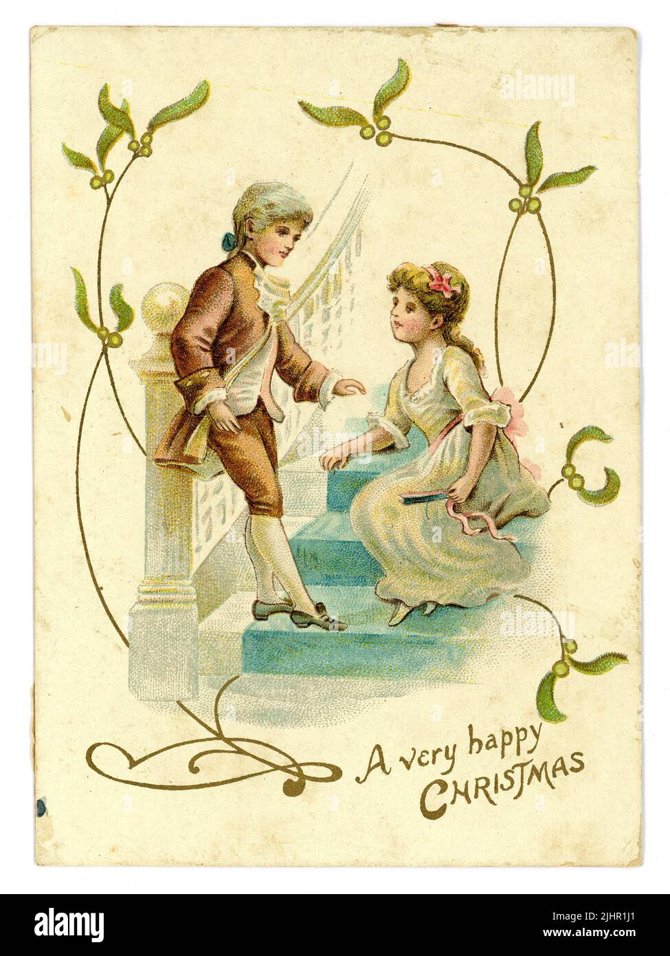 Originale Edwardian era Christmas Greetings card, mistletoe, bambini in stile Regency periodo (Regency era 1811-1820) vestiti coppia bambino corteggiamento, circa 1905 Regno Unito Foto Stock