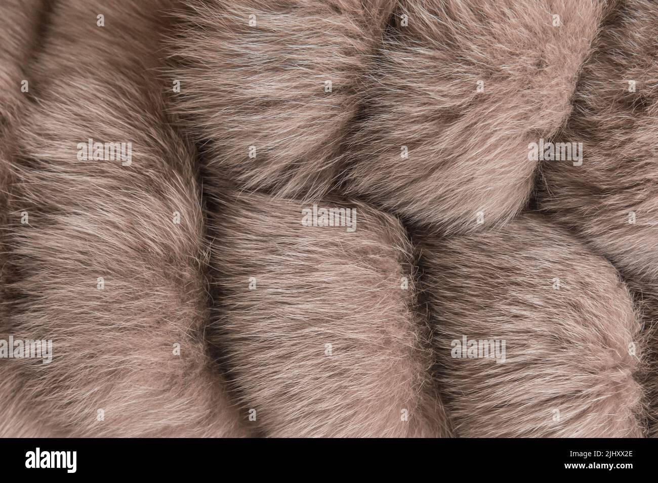 Donna marrone naturale mezzo rivestimento materiale pelliccia lana tessuto sfondo. Foto Stock