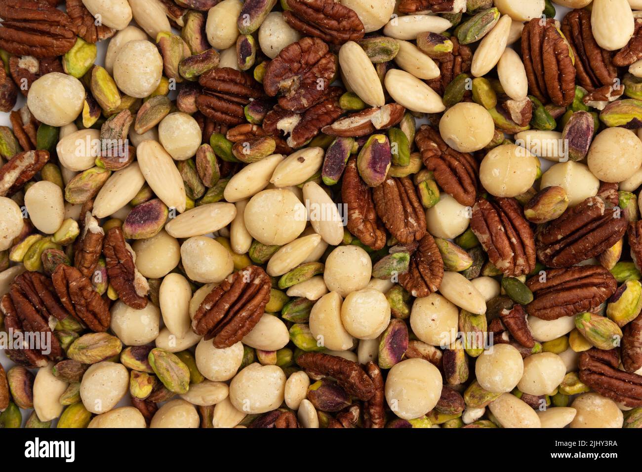 mix di noci, assortiti e vari di noci come sfondo, vista dall'alto, mucchio da vari tipi di noci pelate, mandorla, noce, nocciola, cashew, pistacchio e. Foto Stock