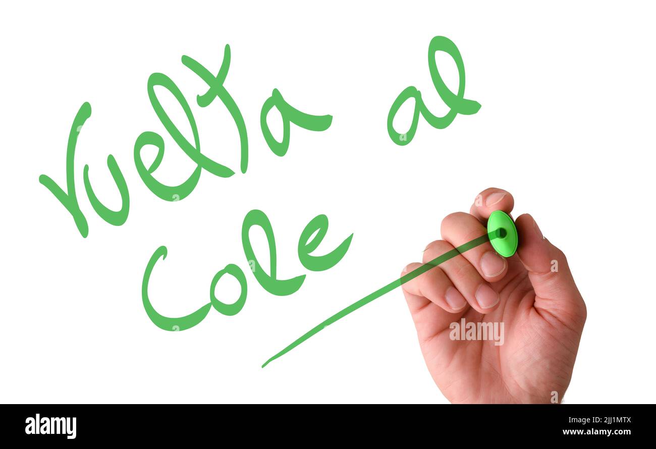 Scrivere a mano in aria sullo schermo Vuelta al cole con un marcatore verde con fondo bianco isolato Foto Stock