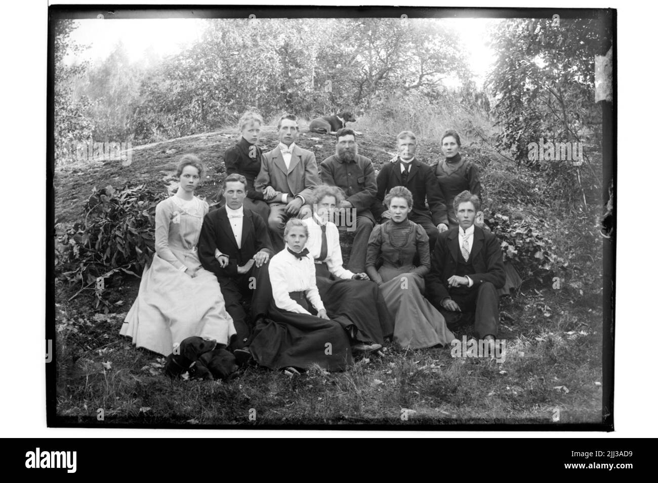 Gruppo, 11 persone e un cane. Foto Stock