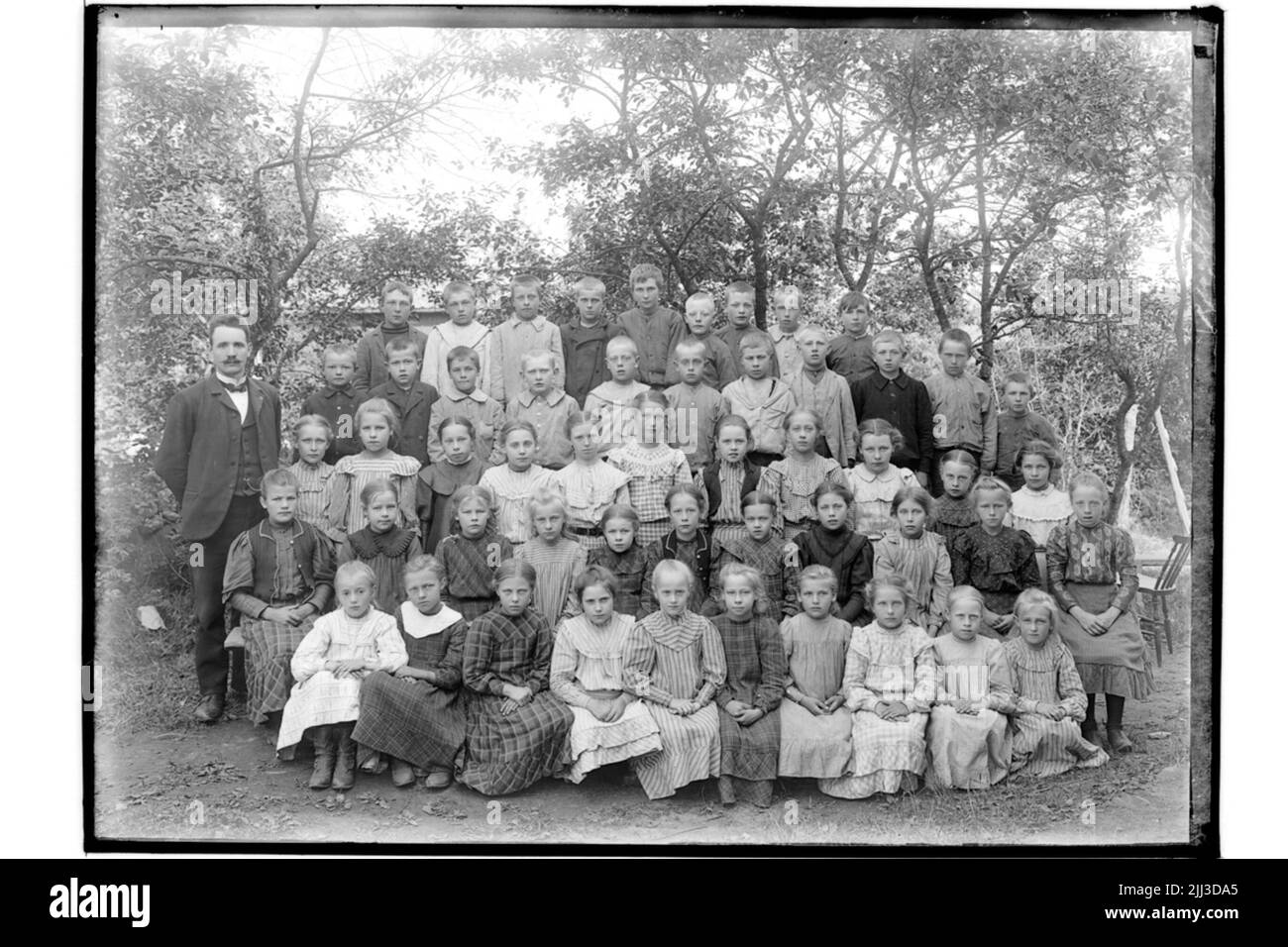 USTA School, 52 bambini con insegnanti. Insegnante di scuola F. Dahlander Foto Stock