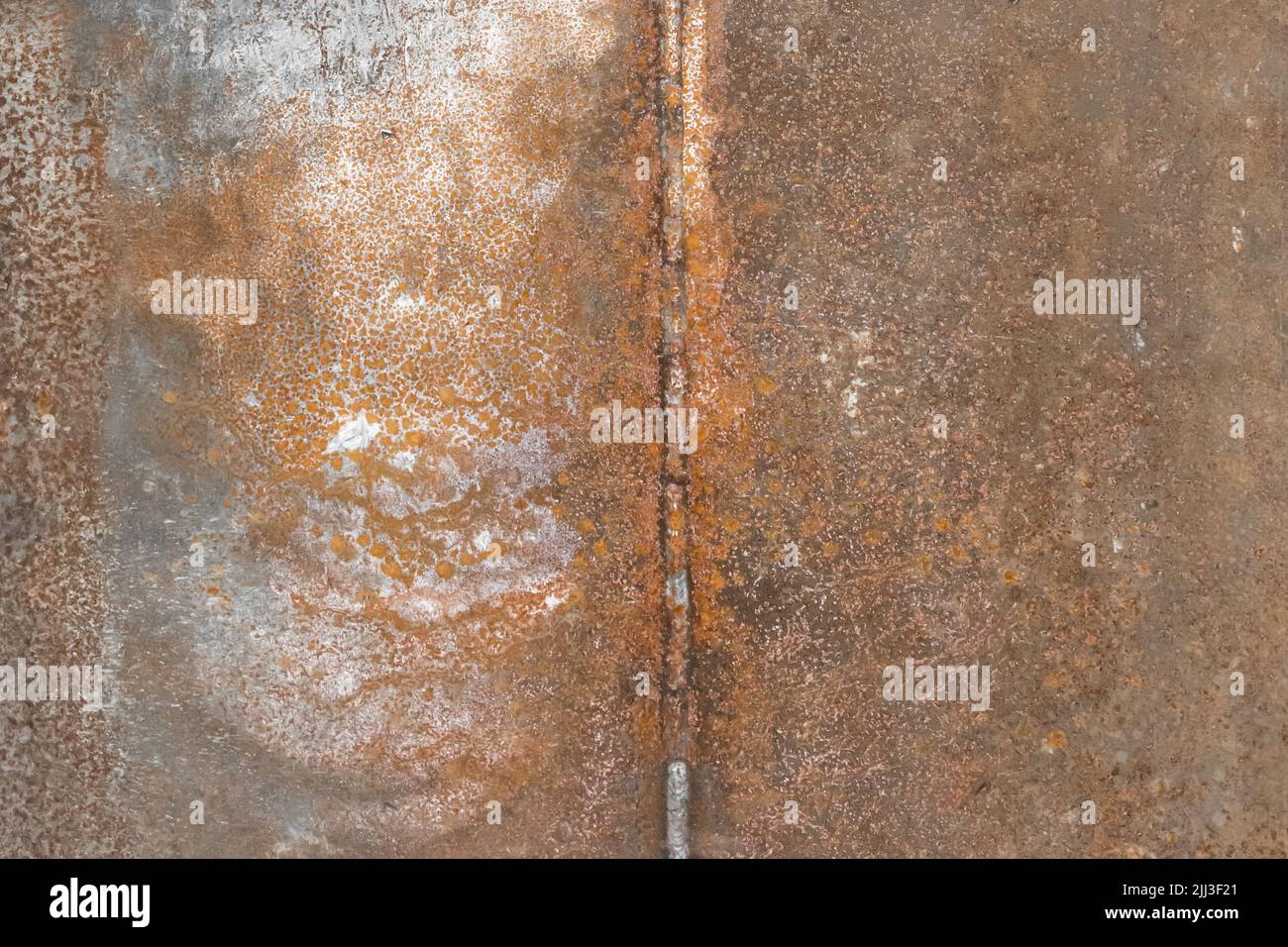 Processo saldatura lavoro scorie industria acciaio vecchio arrugginito lavorazione tessuto fondo. Foto Stock