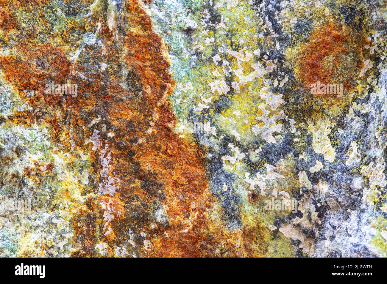 Sfondo naturale di roccia di colore rosso, grigio, giallo e blu Foto Stock