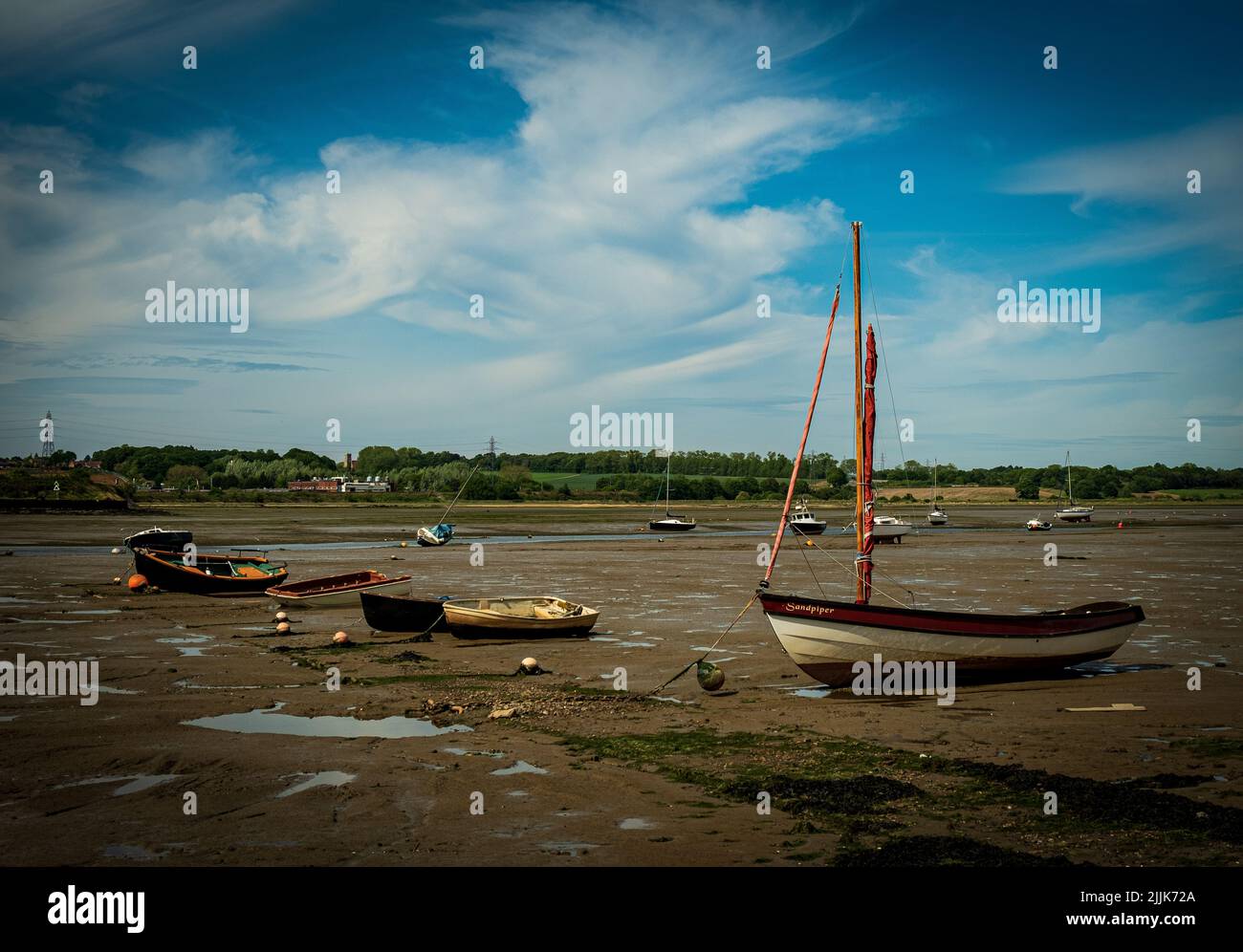 Le barche sul fango a bassa marea Foto Stock