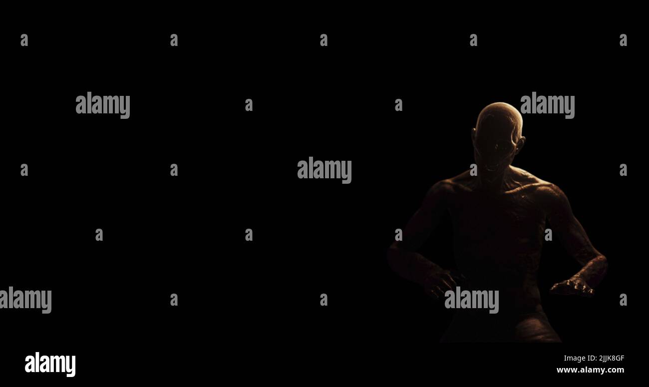 Immagine di una figura calva e trita che tiene la testa nel dolore in una stanza buia Foto Stock
