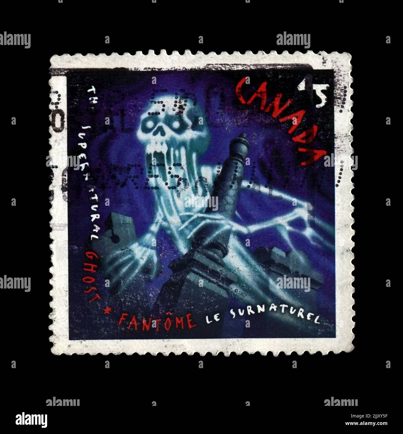 Ghost, mostro invisibile, circa 1997. vintage cancellato timbro postale stampato in Canada isolato su sfondo nero Foto Stock