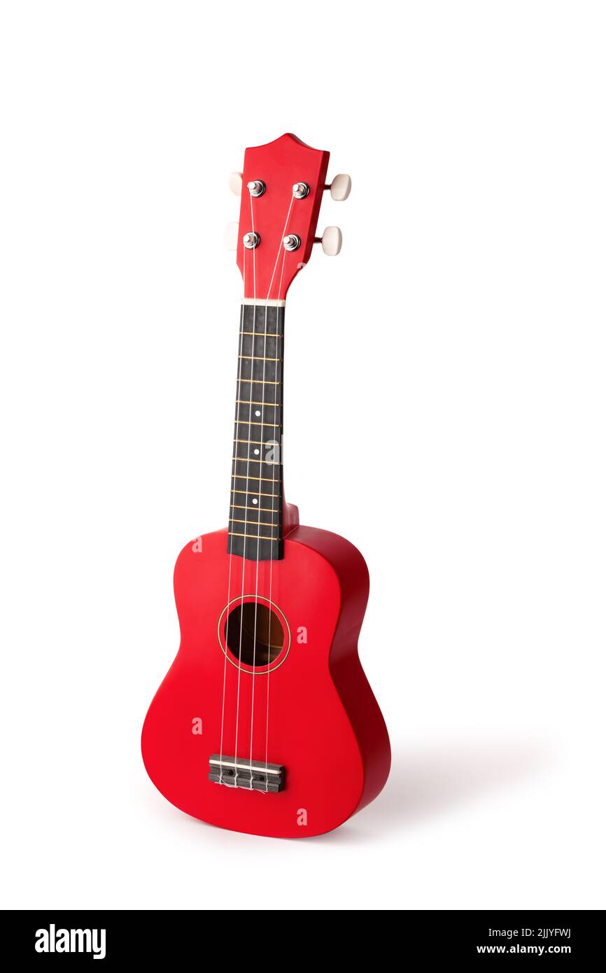 La chitarra rossa ukulele hawaiana è isolata su sfondo bianco Foto Stock