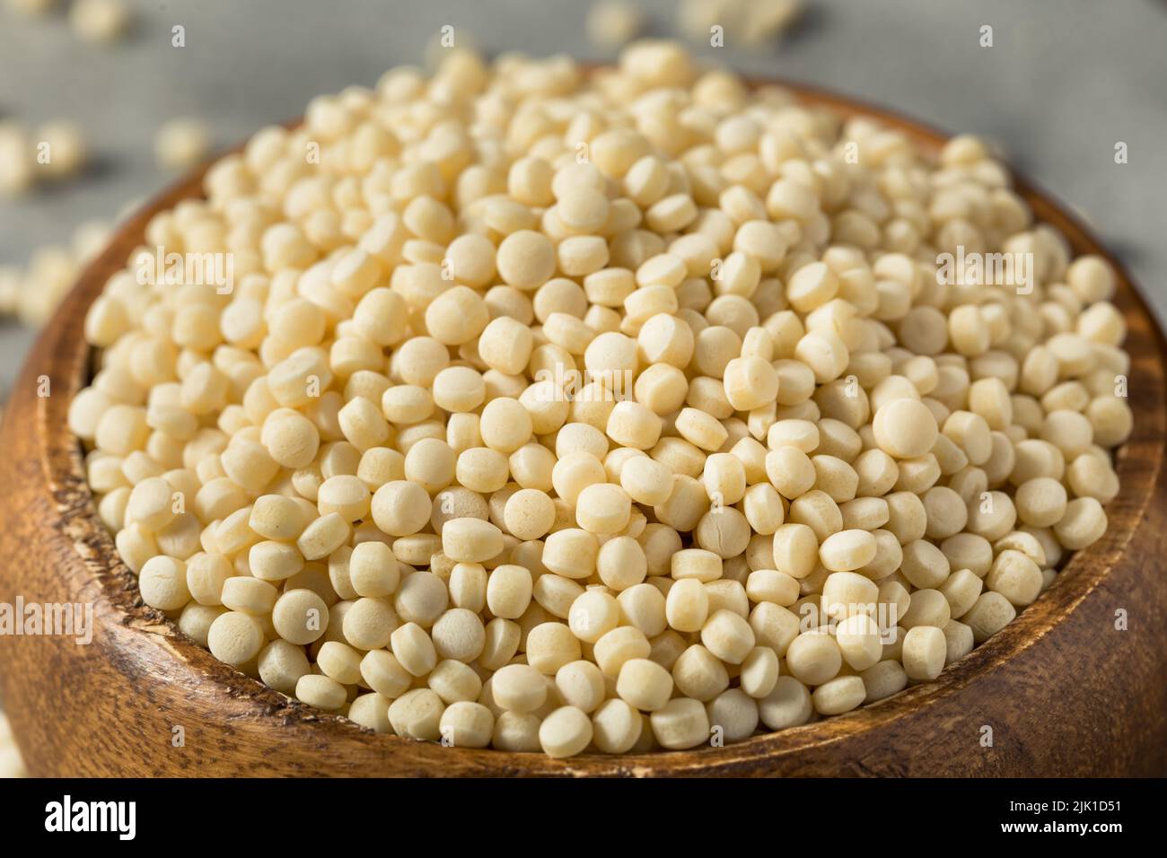 Materie organico secco il cous cous in una ciotola Foto Stock