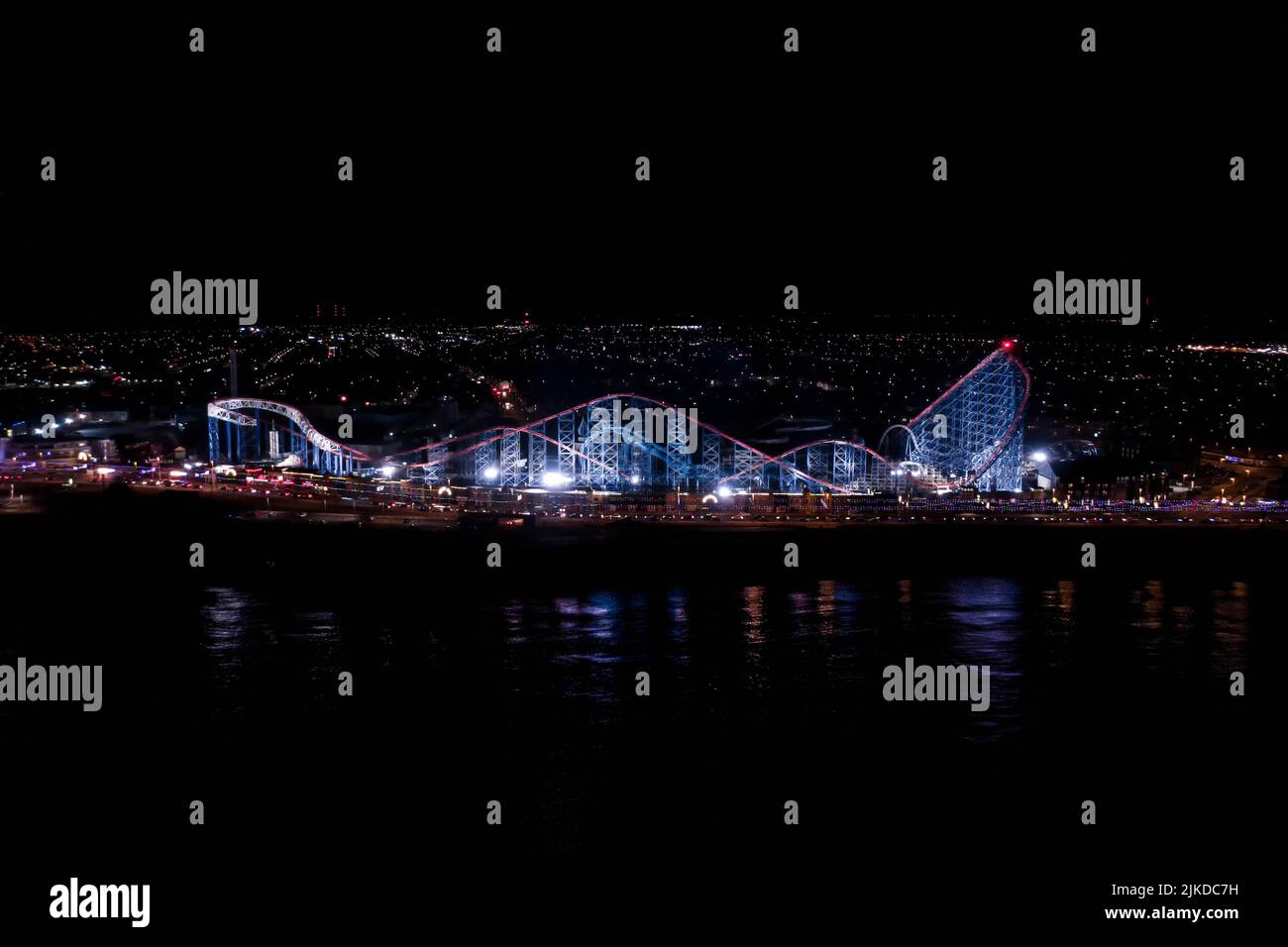 Blackpool Pleasure Beach BPB The Big One Rollercoaster Roller Coaster Aerial from the Air Birds Eye View at Night during Illuminations Foto Stock