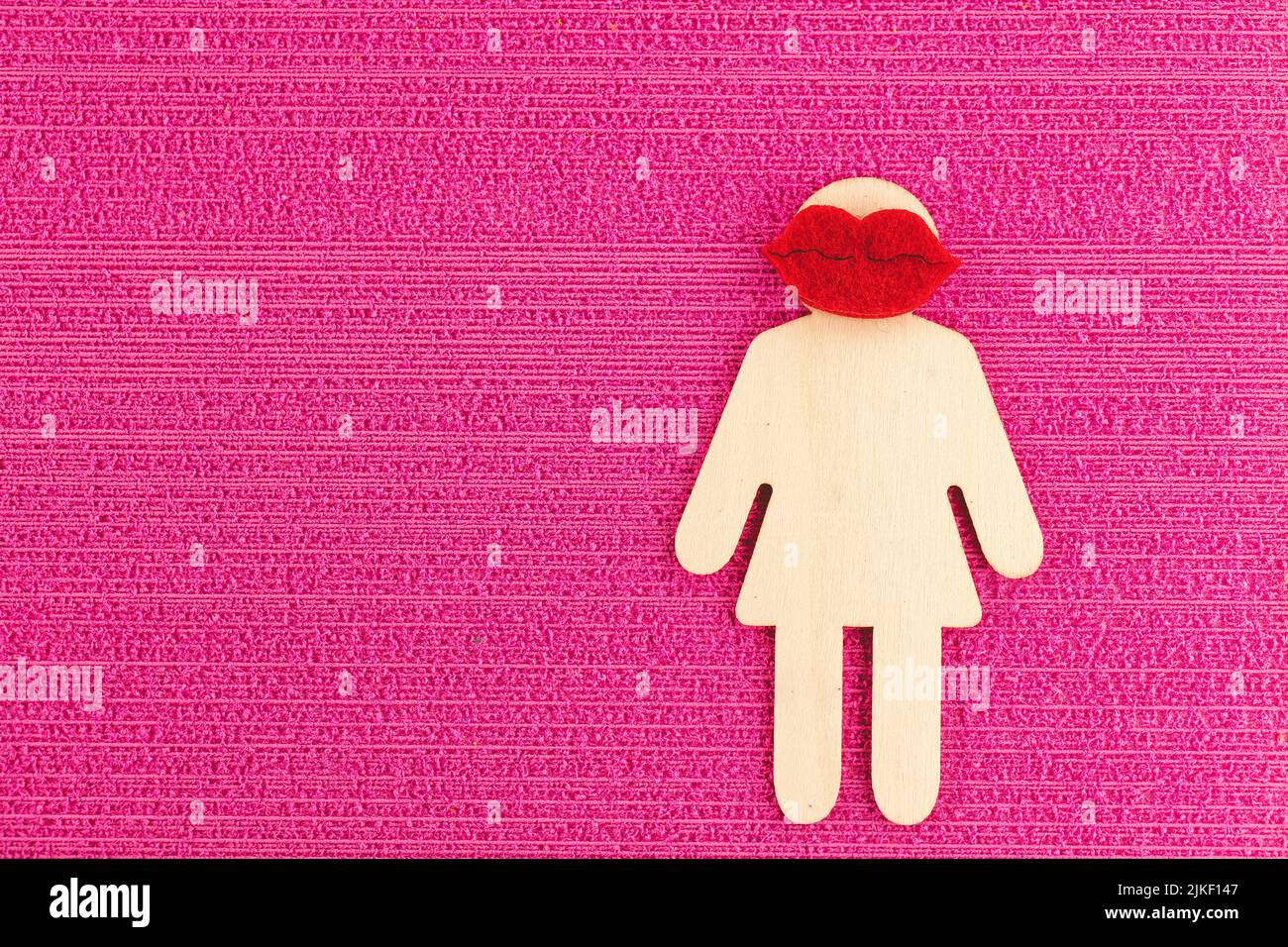 Segno femminile su sfondo rosa Foto Stock