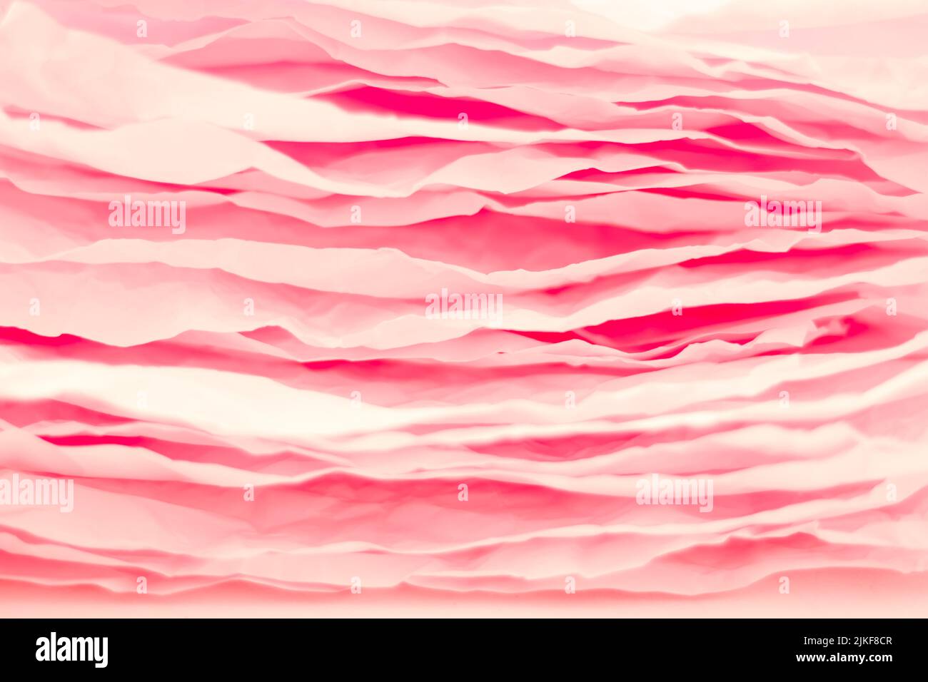 i livelli di carta rosa impilano uno sfondo astratto ondulato Foto Stock
